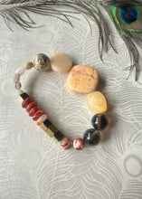 Load image into Gallery viewer, Carnelian, peach stone, Smokey quartz, hematite gemstone bracelet on peacock feather background