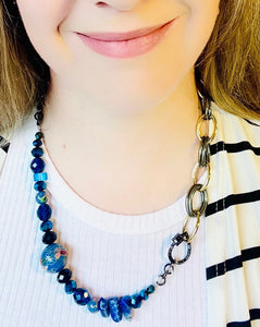 Blue cloisonné , lapis lazuli and crystal beaded statement necklace worn with black and white stripe top