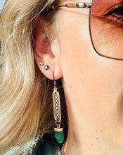 Load image into Gallery viewer, Gold plated loops with sterling silver chain centre, gunmetal loops &amp; ear hooks with Malachite style pointed feature stones on model ear with sunglasses