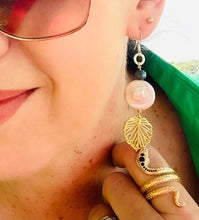 Load image into Gallery viewer, girl-in-green-shirt-with-sunglaees-snake-ring-waering-gold-leaf-charm-with-white-20mm-keshi-coin-pearl-turquoisr freshwater -pearl-hanging-from-silver-ear-hook