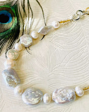 Load image into Gallery viewer, mixed shape white keshi pearl necklace with gold and silver chain next to peacock feather 