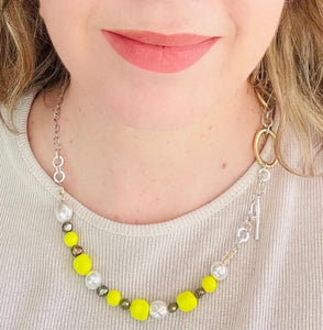 Neon yellow Swarovski crystal & freshwater pearl  necklace worn on girl with blond hair & lipstick