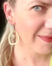Load image into Gallery viewer, Purple &amp; Gold round enamel Cloisonné Bead earrings including gold plated hammered finish loop with crystals &amp; sterling silver ear hooks worn on a model with blonde hair blue eyes &amp; a yellow top