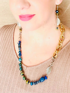 Silver leaf necklace with lapis lazuli blue crystal & freshwater pearl worn on model
