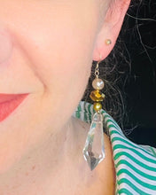 Load image into Gallery viewer, Earrings with Clear Quartz Crystal Faceted point feature stone with Swarovski Crystal &amp; freshwater pearl on filled gold ear hooks on model with green stripe shirt and red lips