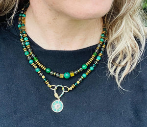 green malachite & gold beaded necklace with gold cain on model with black top