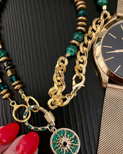 Load image into Gallery viewer, Green Malachite  necklace with 18ct gold plated crystal embellished pendant on black background with watch &amp; red manicure