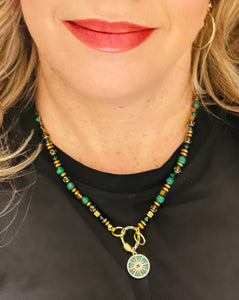 Green Malachite  necklace with 18ct gold plated crystal embellished pendant on model in black top with red lip