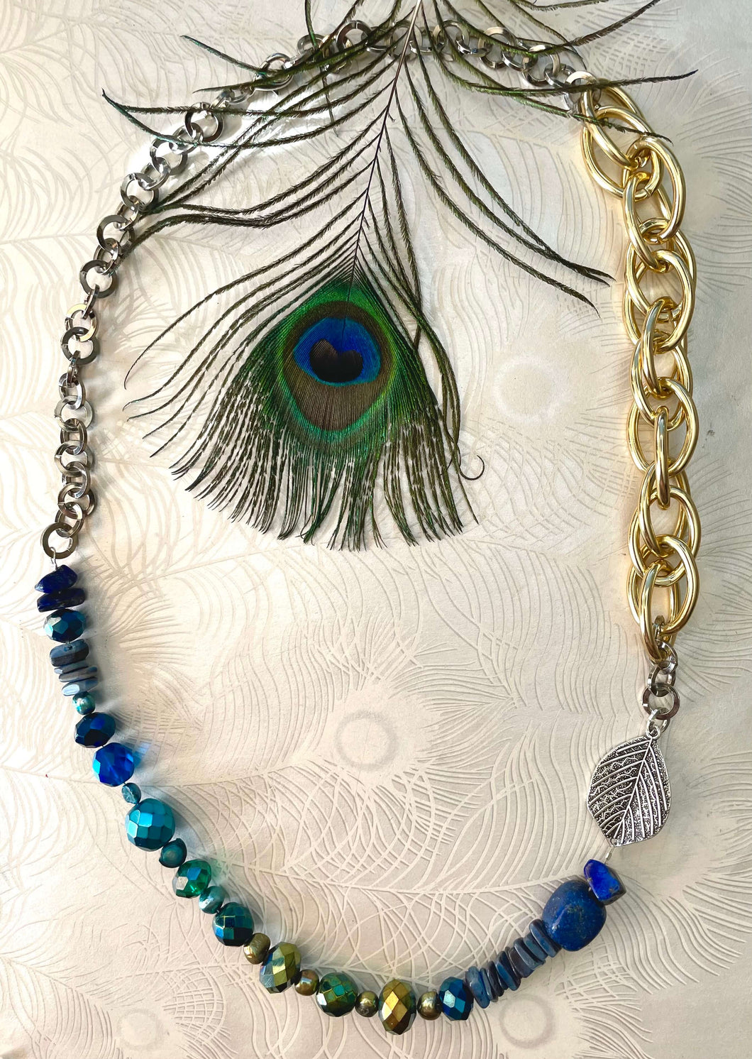 Silver leaf necklace with lapis lazuli blue crystal & freshwater pearl  with gold & silver chain & peacock feather in centre