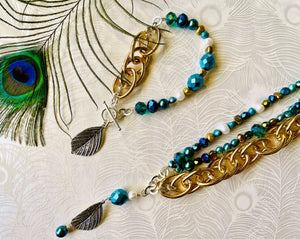Silver leaf hanging off sterling silver toggle clasp with turquoise & blue crystal & gold chain bracelet & necklace set